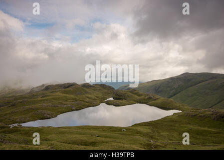 Besprengung Tarn, Lake District, England, Großbritannien Stockfoto