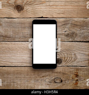 Smartphone mit leeren Bildschirm auf hölzernen Hintergrund Stockfoto