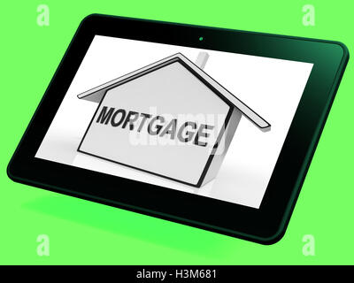 Hypothek Haus Tablet zeigt Immobiliendarlehen und Rückzahlungen Stockfoto