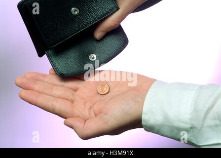 Portemonnaie mit Hand und eine letzte Münze Stockfoto