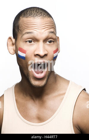 Fußball-Fan, erstaunt männlich, Freude, Portrait, Studio, Modell veröffentlicht, 20-30 Jahre, dunkelhäutige, Schönheit, Fußball, Weltmeisterschaft, WM, Nationalität, Süden, Afrika, Mann, Nigerianer, ausgeschnitten, Gesichtsbemahlung, Holland, Niederlande, fl Stockfoto