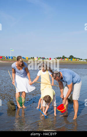 Familie in Watt Stockfoto