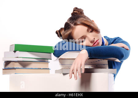 müde Schüler schlief auf Lehrbücher, isoliert Stockfoto