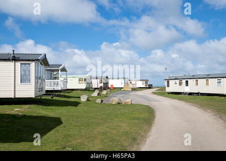 Mobilheime auf den Dünenwanderungen Sands Caravan Park auf einem sonnigen Sommern Tag Nr. Perranporth, Cornwall, UK Stockfoto