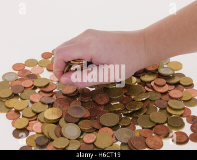 Hand greift für Münzen Stockfoto