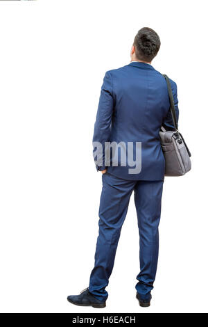 In voller Länge Portrait junger Geschäftsmann im blauen Anzug. Junger Mann, Kamera zeigt Rückansicht zurückzugeben. Isoliert Stockfoto