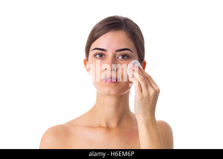 Junge Frau mit Wattepads Stockfoto