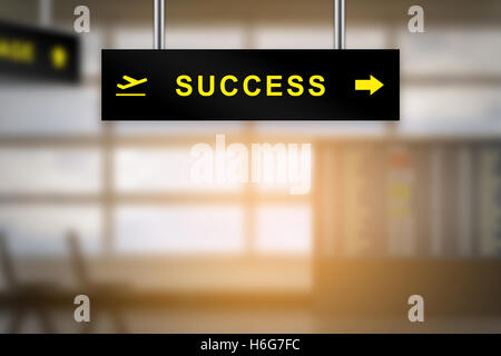 success on airport sign board with blurred background and copy space Stockfoto