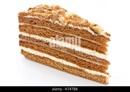 Der mehrschichtige Honigkuchen in Scheiben schneiden. Stockfoto