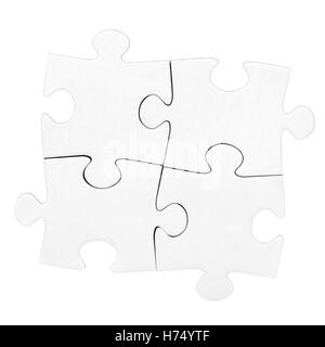 4 Karton Puzzlestücke, die isoliert auf weiss Stockfoto