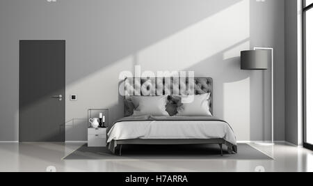 Schwarze und graue Hauptschlafzimmer mit eleganten Doppelbett und geschlossener Tür - 3d rendering Stockfoto