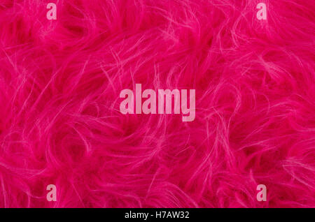 Rosa Plüsch. Sehr weicher Polyester-Textilien hergestellt aus synthetischen Fasern mit langen Haaren. Makro schließen Material Fotografie. Stockfoto