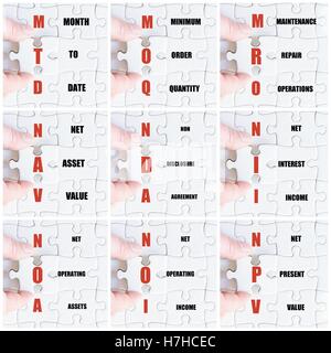 Photo collage with hand of business man completing the puzzle with the last missing piece Stockfoto