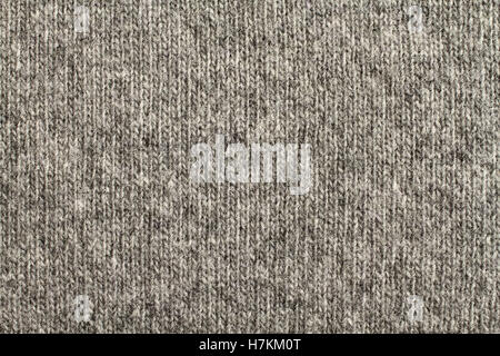 Hellgrau mit schwarz meliert gestrickt Wolle Stoff Textur. Makro. Stockfoto