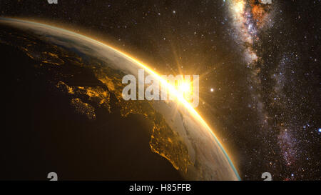 Orange Sunrise über die Erde vom Weltraum aus gesehen. Mit Sternen Hintergrund. Stockfoto
