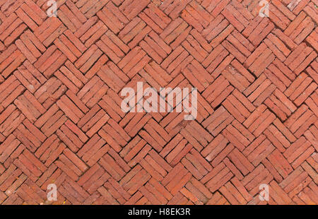 Alten Backstein Pflaster auf einem Bürgersteig, antiken alten roten Ziegeln Grunge Boden Fragment Hintergrund, Oberfläche Stockfoto