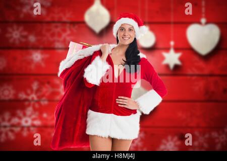Weiblichen Weihnachtsmann stehend gegen generiert Digital Hintergrund Stockfoto