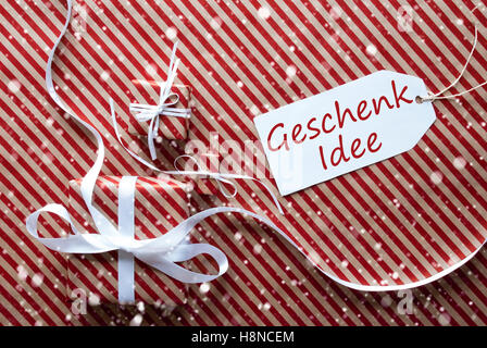 Geschenke mit Label, Schneeflocken, meistverkauftes Idee bedeutet Geschenk-Idee Stockfoto