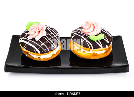 Bunte Kekse Kuchen Busch mit Sahnehäubchen und Creme-Füllung. Studio Photo Stockfoto