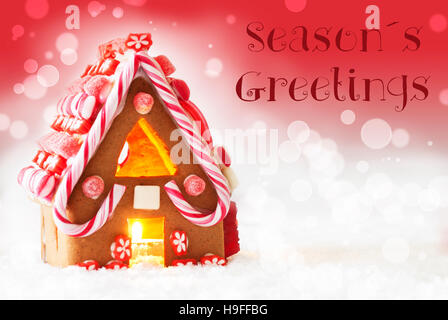 Lebkuchen Haus, roter Hintergrund Text Seasons Greetings Stockfoto