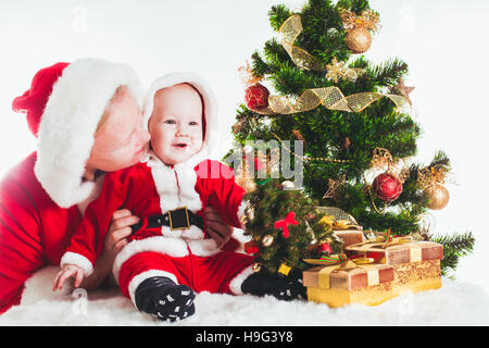 Weihnachten Baby und Mama Stockfoto