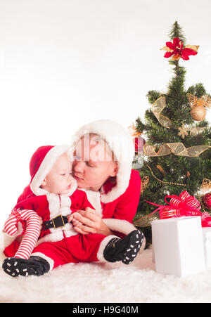 Weihnachten Baby und Mama Stockfoto