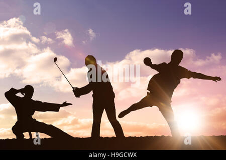 Zusammengesetztes Bild der Rückansicht der Sportler werfen einen Schuss Stockfoto