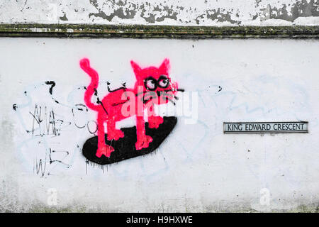 Graffiti - ein Cartoon rosa Katze auf eine Wand gesprüht. Stockfoto