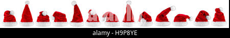 Breite Panorama-Reihe der rot weiße Plüsch Weihnachtsmann Weihnachten Xmas Mütze isoliert Hintergrund Stockfoto