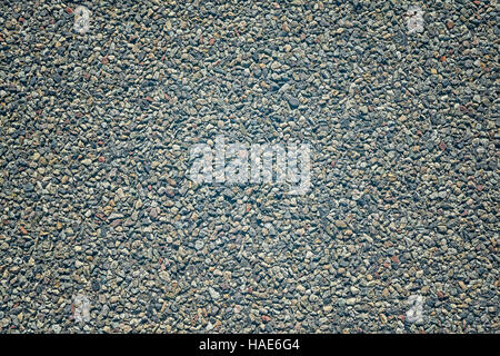 Farbe getönt Splitt im Asphalt, Hintergrund oder Textur. Stockfoto