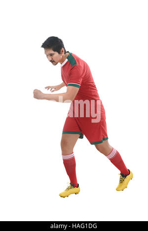 Bild des asiatischen Fußball-Spieler auf weißem Hintergrund läuft Stockfoto