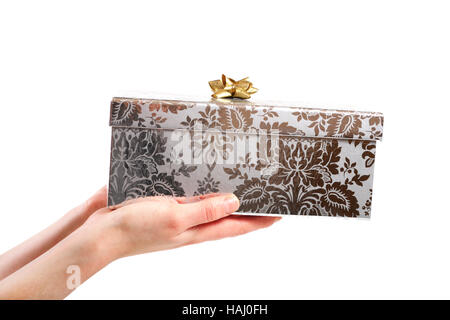 Geschenk-Box in den Händen isoliert auf weißem Hintergrund Stockfoto