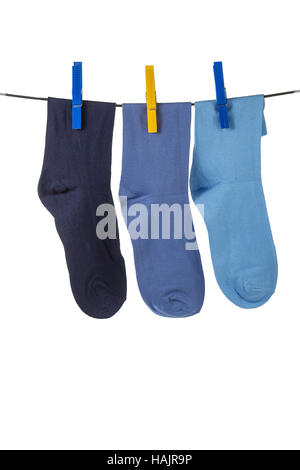 Socken an der Wäscheleine hängen Stockfoto