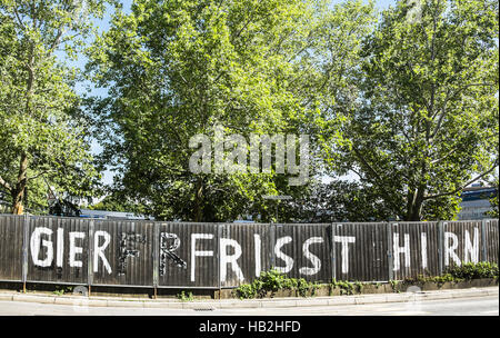 Gier frisst Hirn Stockfoto