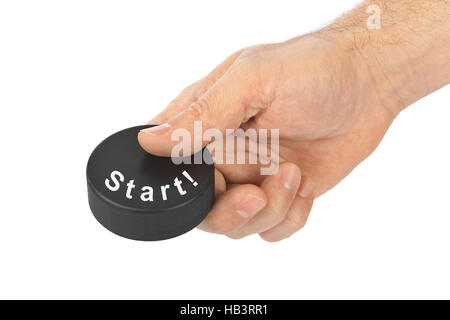 Hand mit Hockey-Puck Start Stockfoto