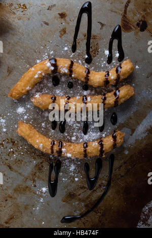 Churros mit Schokolade Stockfoto