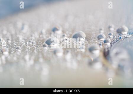 Wassertropfen auf CD Stockfoto