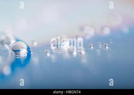 Wassertropfen auf CD Stockfoto