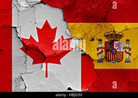 Flagge von Kanada und Spanien auf rissige Wand gemalt Stockfoto