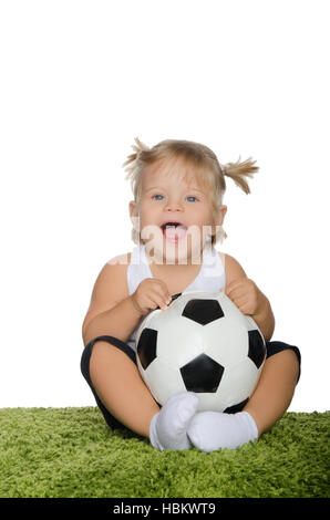 kleines Mädchen mit Fußball Stockfoto