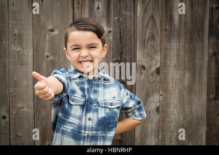 Glückliche junge gemischte Rennen junge Thumbs Up Handbewegung. Stockfoto