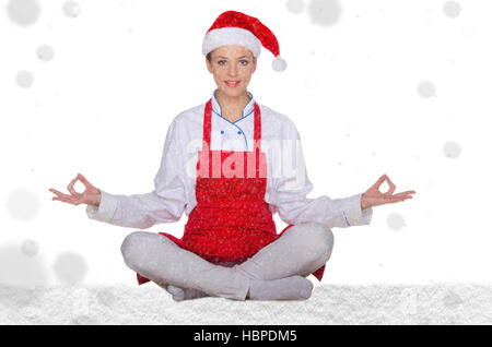 Koch in Hut von Santa Claus mit Schnee Stockfoto