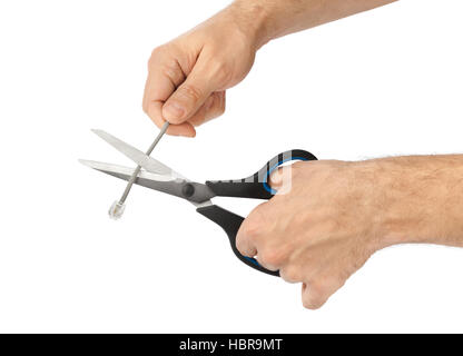 Hand mit Schere und Telefon-Kabel Stockfoto