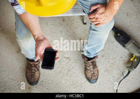 Handy ist von Arbeiter verwendet worden Stockfoto