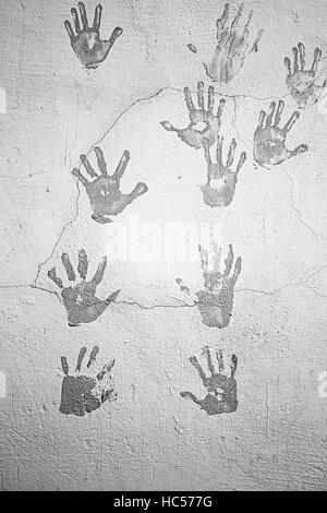 Spuren von schwarzen städtischen Wand Handsymbol Stockfoto