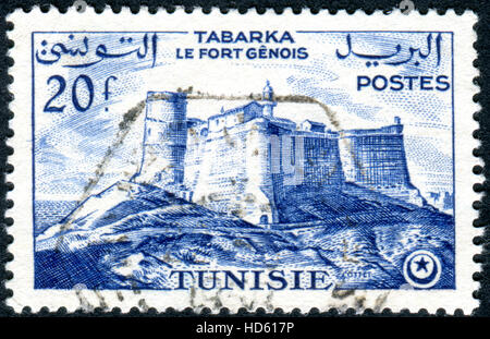 Tunesien - ca. 1954: Eine Briefmarke gedruckt in Tunesien, zeigt die Genueser Festung in Tabarka, ca. 1954 Stockfoto