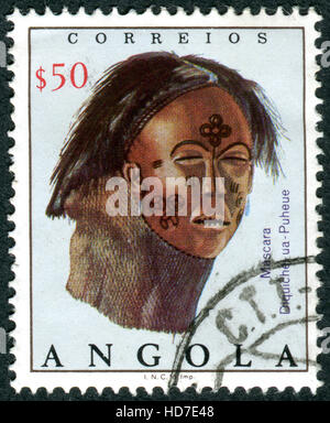 ANGOLA - ca. 1976: Eine Briefmarke gedruckt in Angola zeigt die Diquiche Maske, ca. 1976 Stockfoto