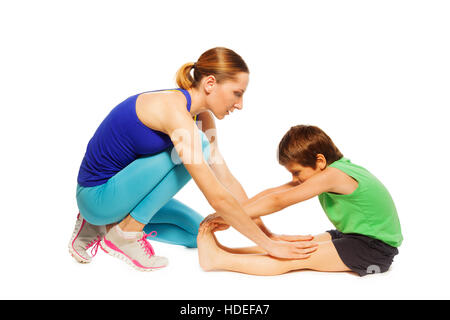 Weibliche Trainer unterrichten Kinder junge Beine Stockfoto