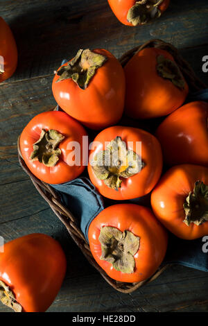 Rohe Bio Orange Perssimons verzehrfertige Stockfoto