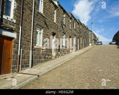 Reihenhäuser auf steilen Hügel UK Skipton Yorkshire Dales Stockfoto